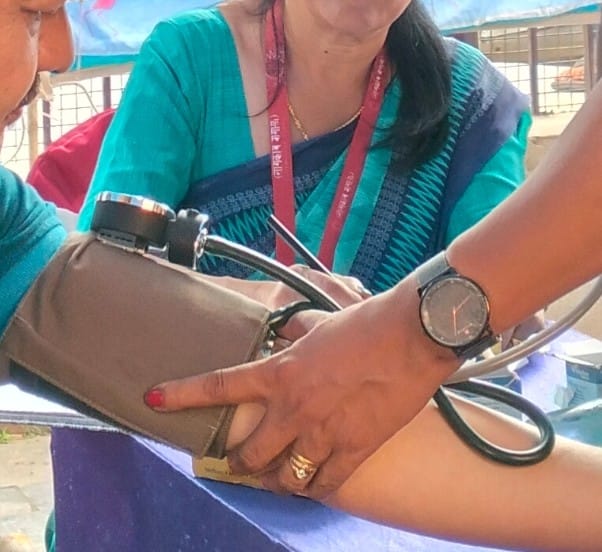 A patient getting their blood pressure measured.