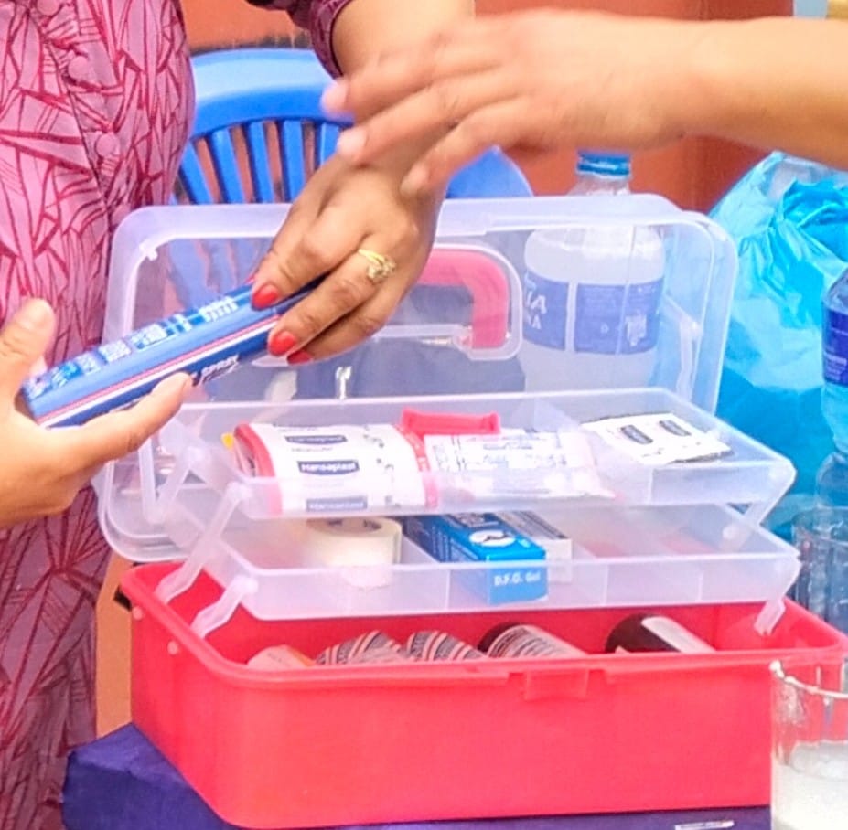 a box with trays filled with bandages and other medical equipment.